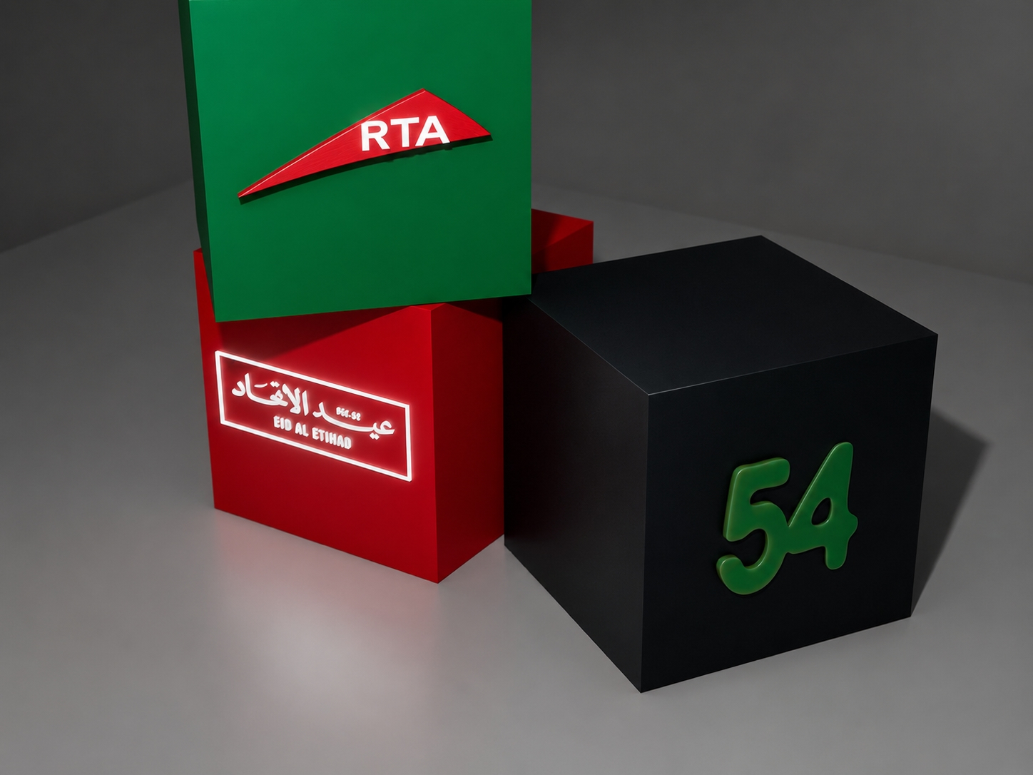 Three RTA Eid Al Etihad branded display cubes featuring illuminated logos and a sculptural 54 element.