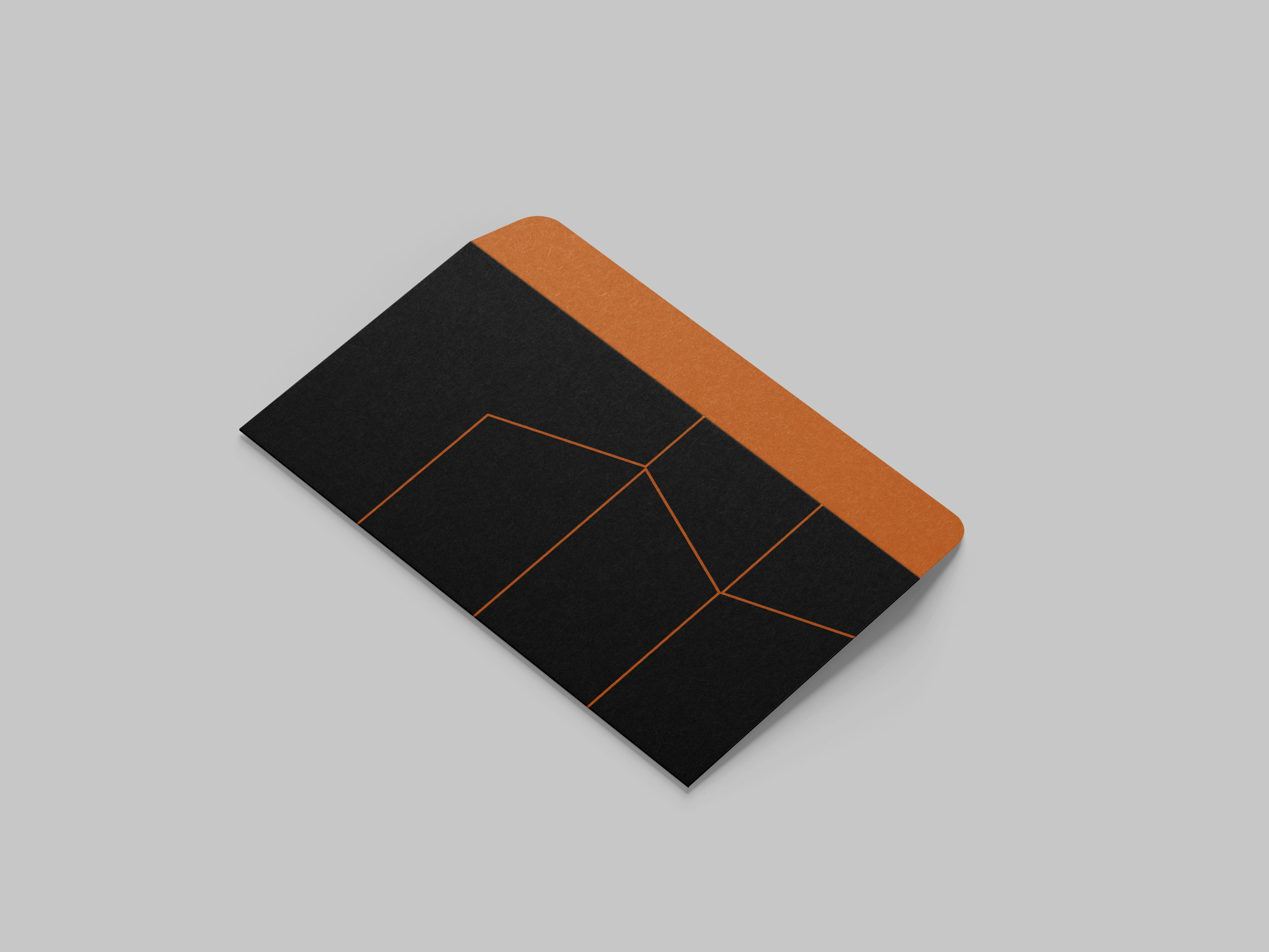 Closed charcoal Alsallal Developments envelope with fine copper architectural linework.