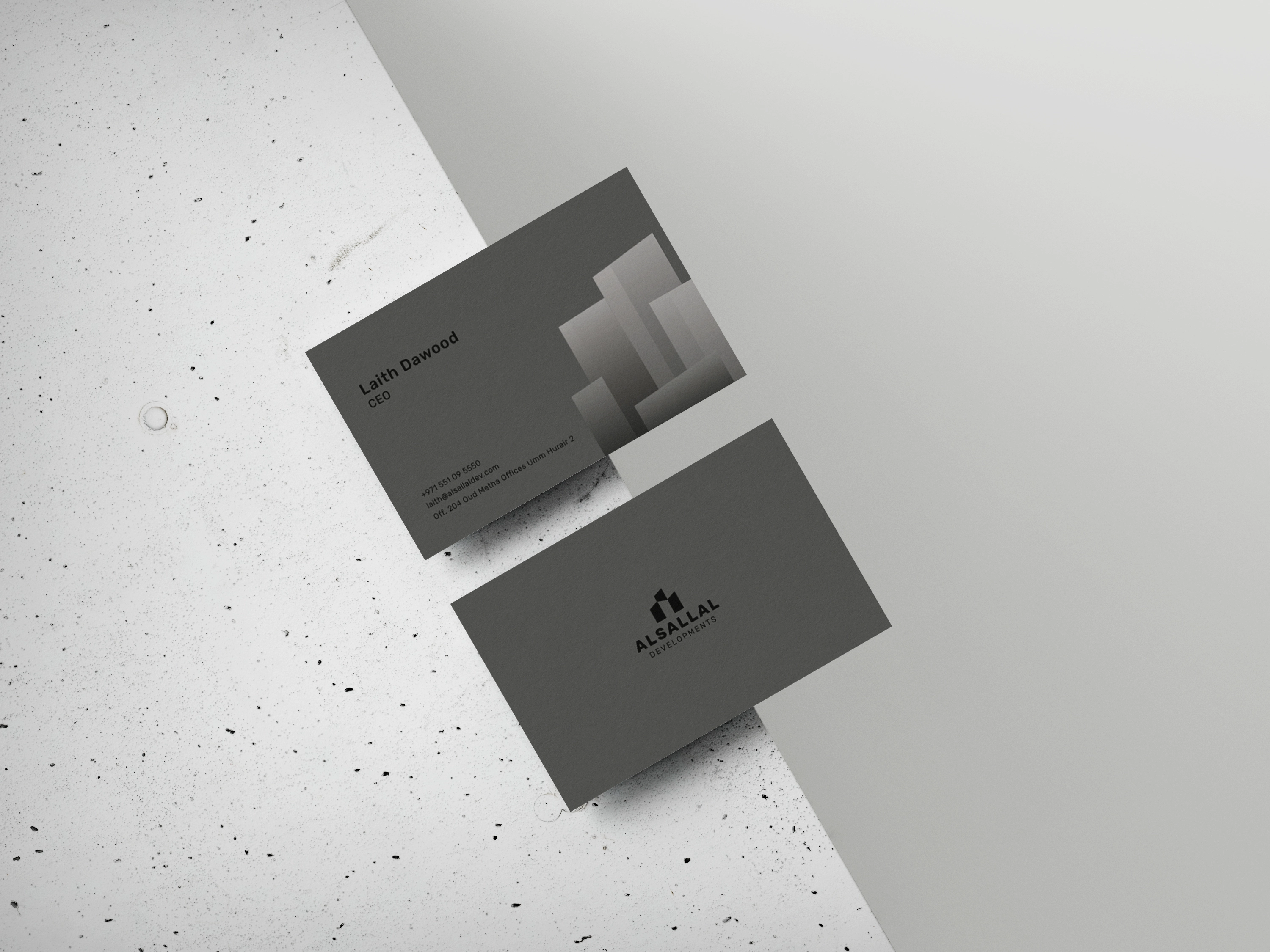 Monochrome gray Alsallal Developments business cards using a dimensional architectural pattern.