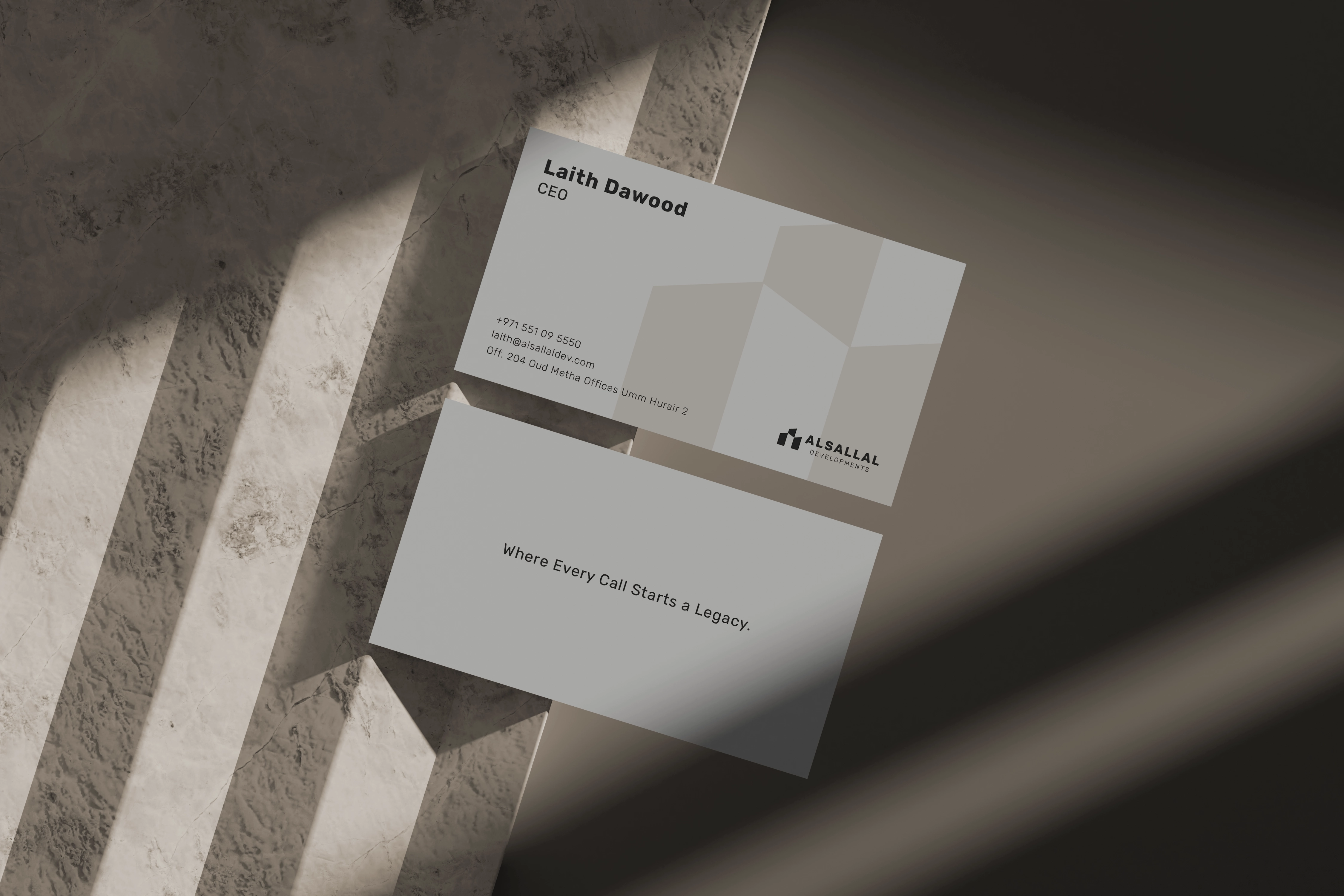 Warm neutral Alsallal Developments business card system shown front and back.
