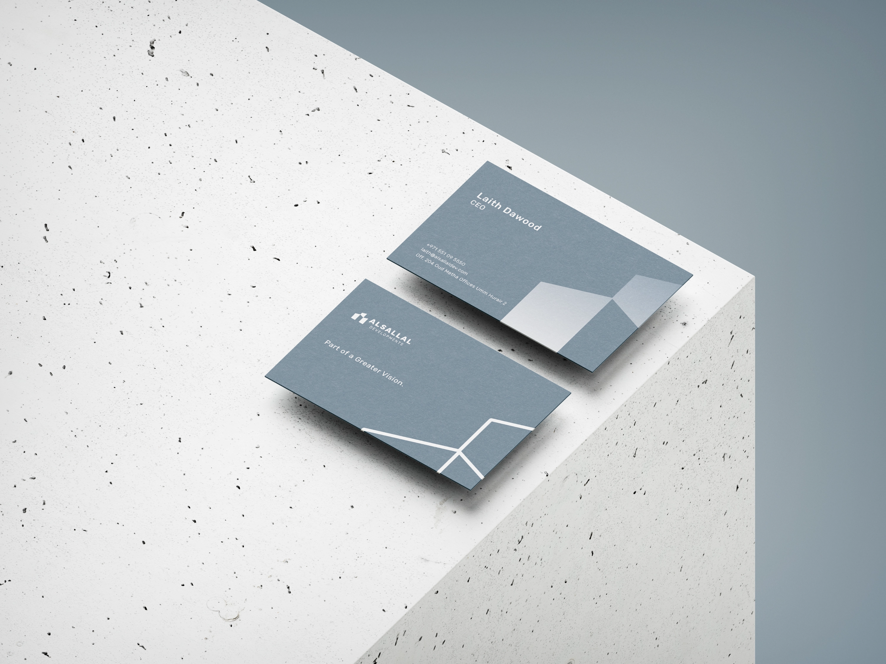 Slate silver Alsallal Developments business cards using layered skyline geometry.