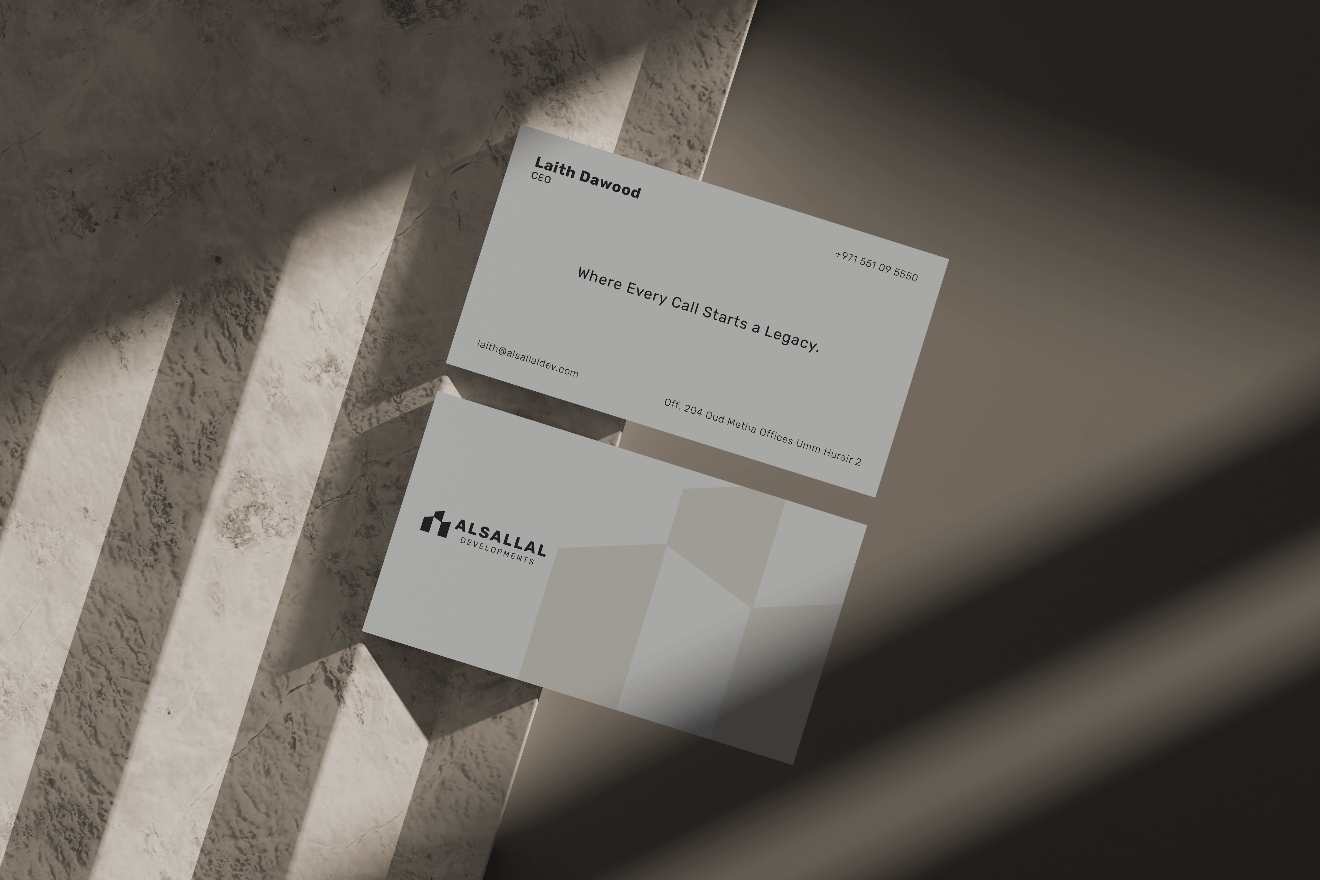 Ivory Alsallal Developments business card system with copper geometric forms.