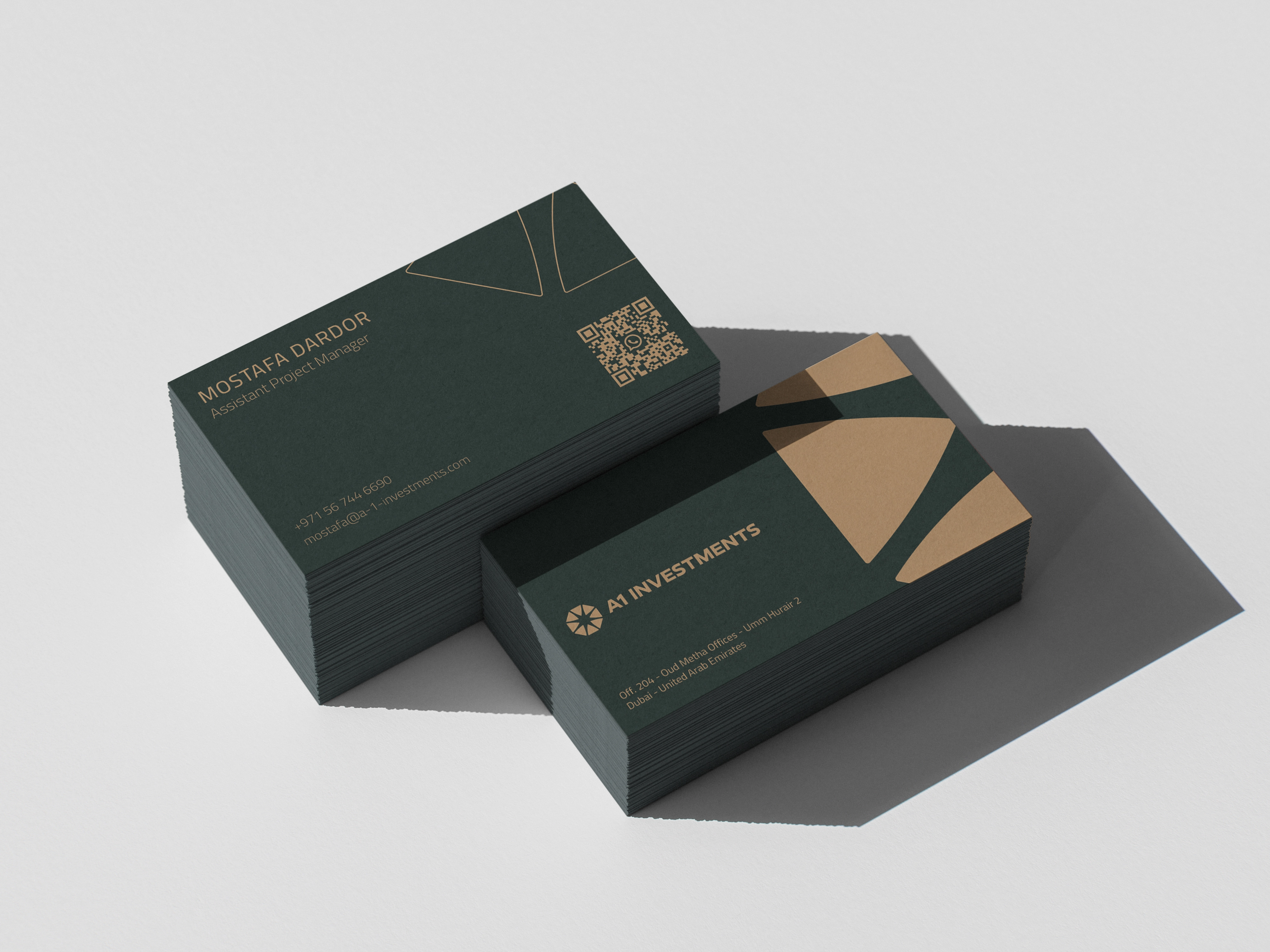 A1 Investments Dubai business card mockup featuring dark green cards, gold geometric branding, employee contact details, and a QR code.