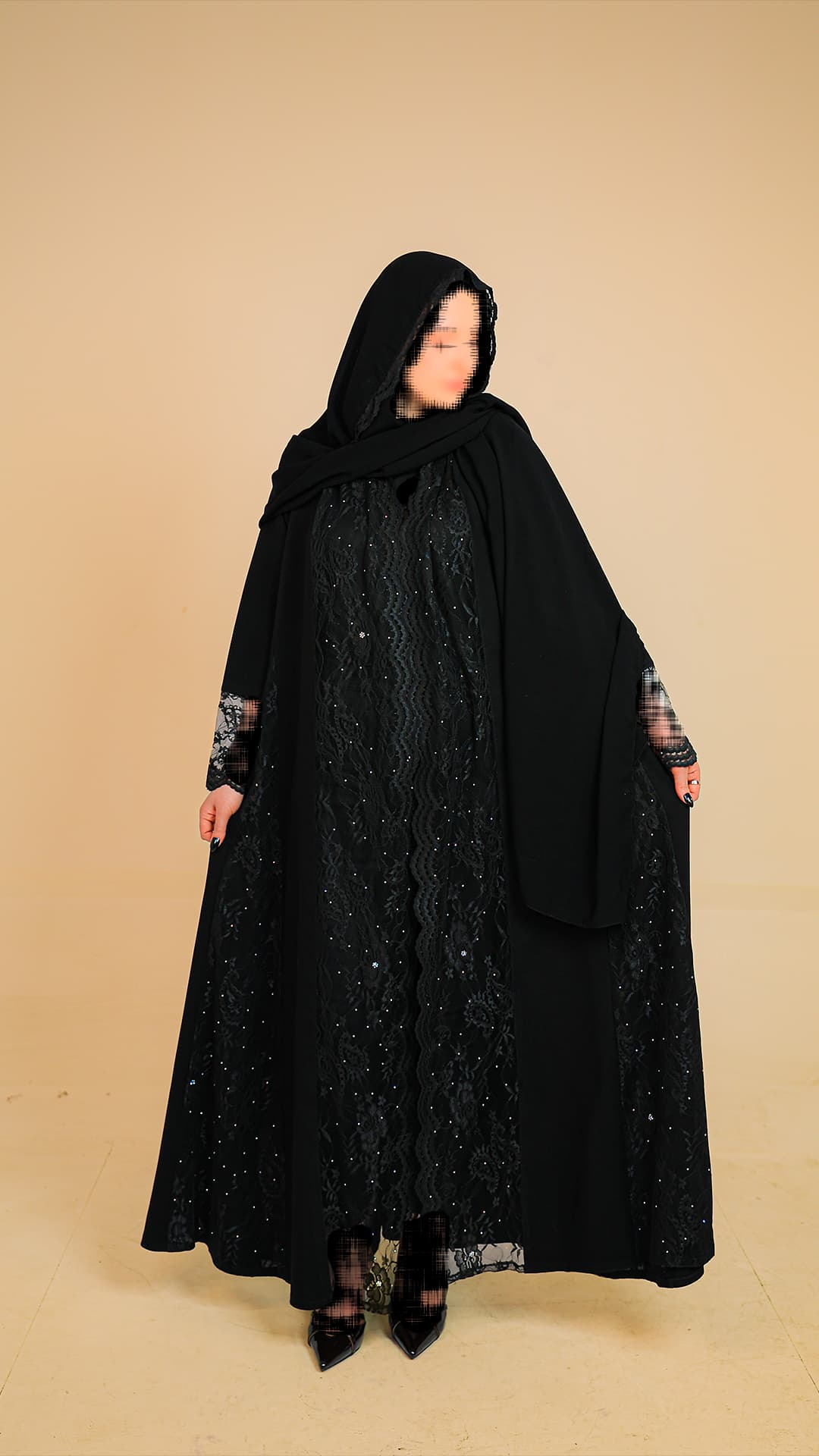 Original product photography for Rilam showing a black lace abaya against a plain studio background.