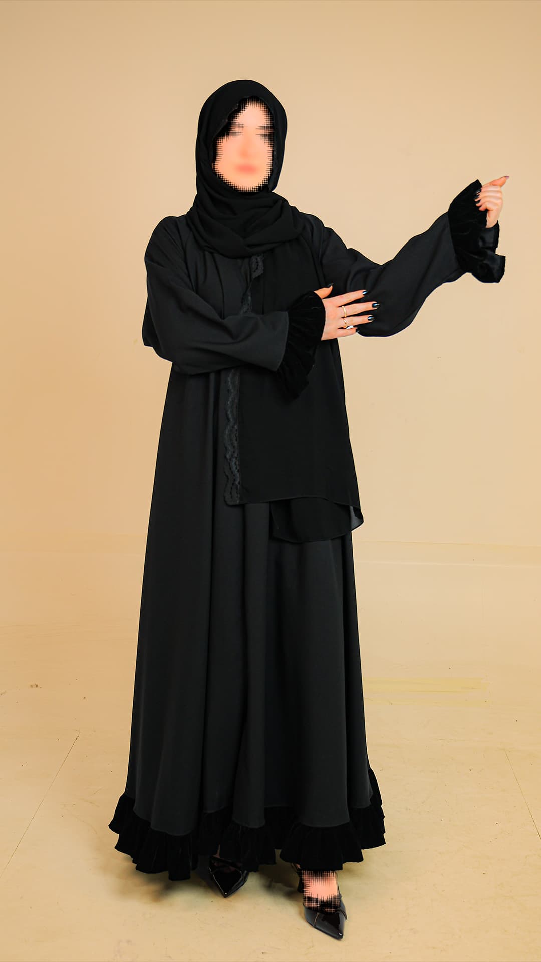 Original product photography for Rilam showing a layered black abaya against a plain studio background.