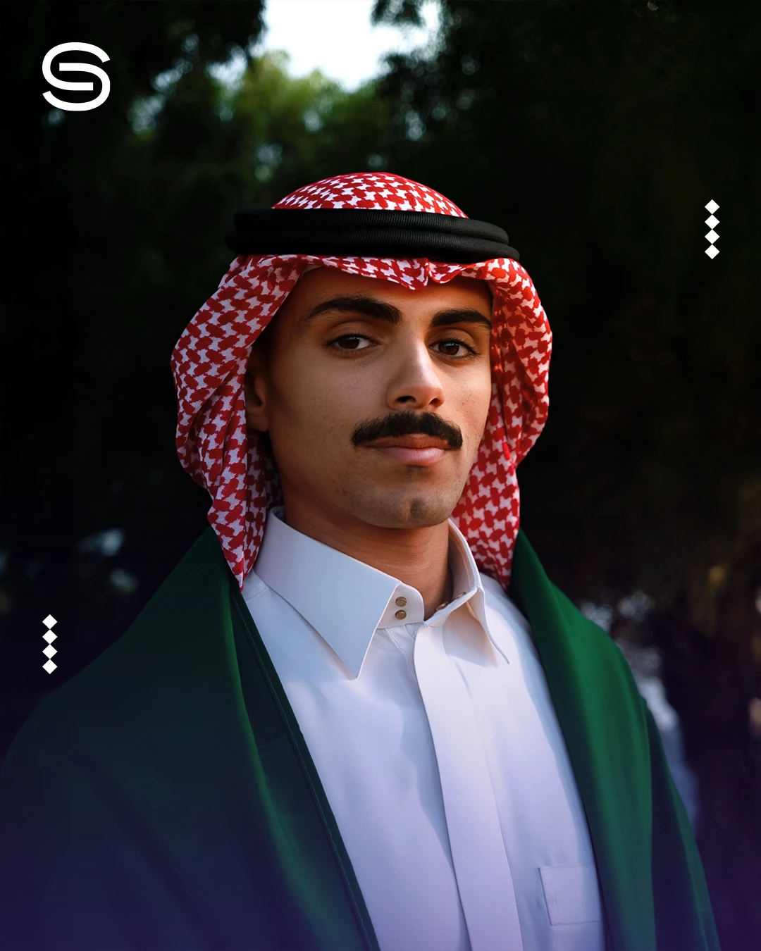 Saudi National Day portrait design with an S monogram and a man wearing a red checked headscarf and Saudi flag.